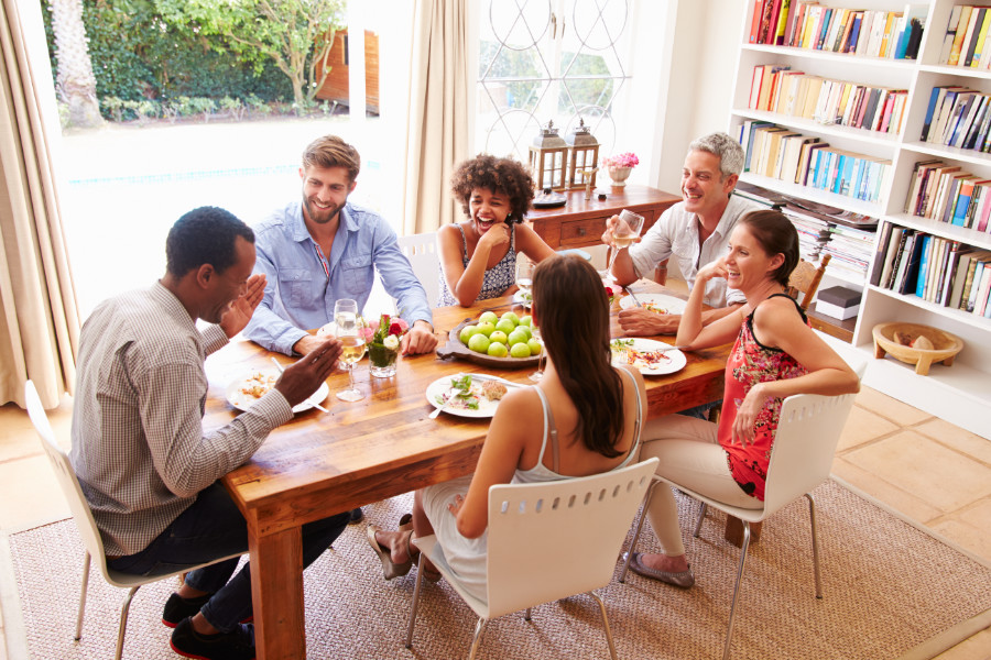 Friends-sitting-at-a-table-talking-during-a-dinner-party-479725098_5184x3456_monkeybusinessimages_